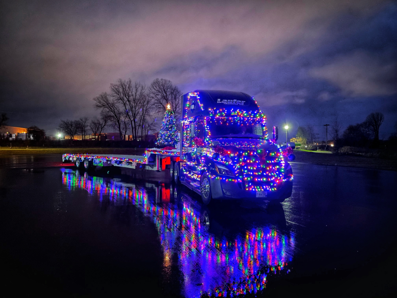 Laufer truck wrapped in Christmas lights